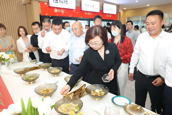 Attendees tasting pre-prepared dishes